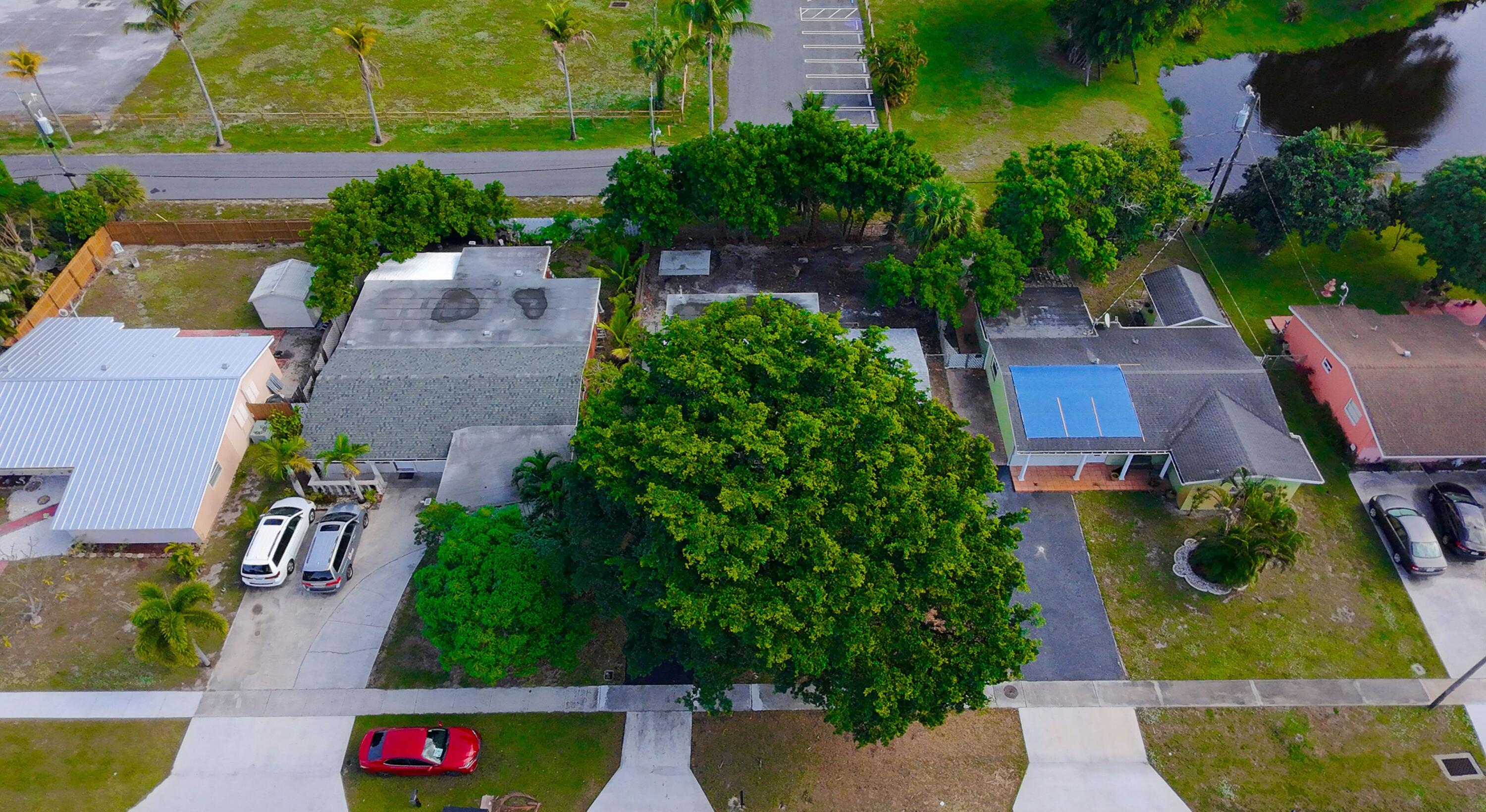 62 Andros Road Palm Springs, FL 33461 - Photo 30 of 41 an aerial view of a house with a yard