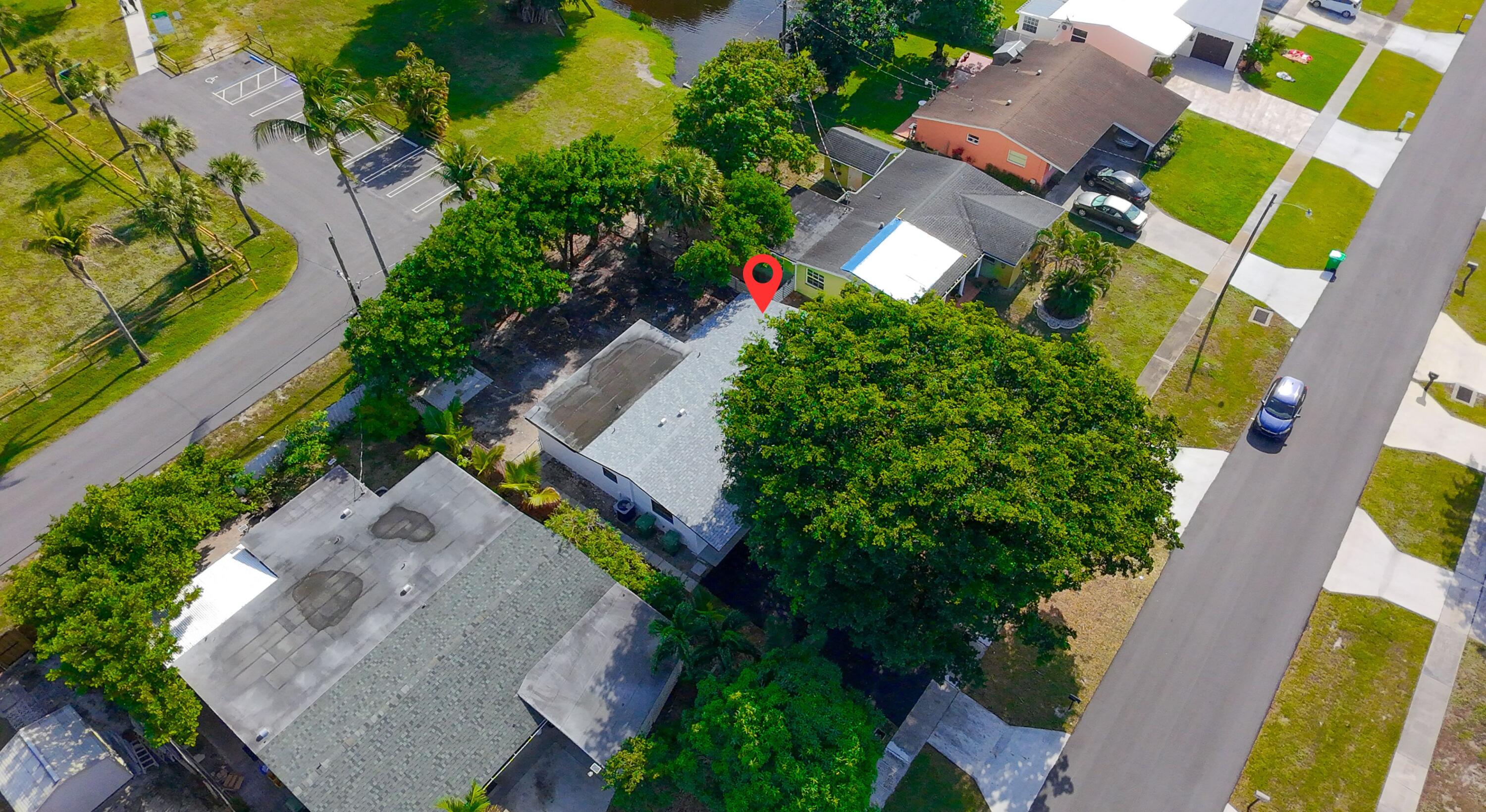 62 Andros Road Palm Springs, FL 33461 - Photo 34 of 41 an aerial view of a house with a yard