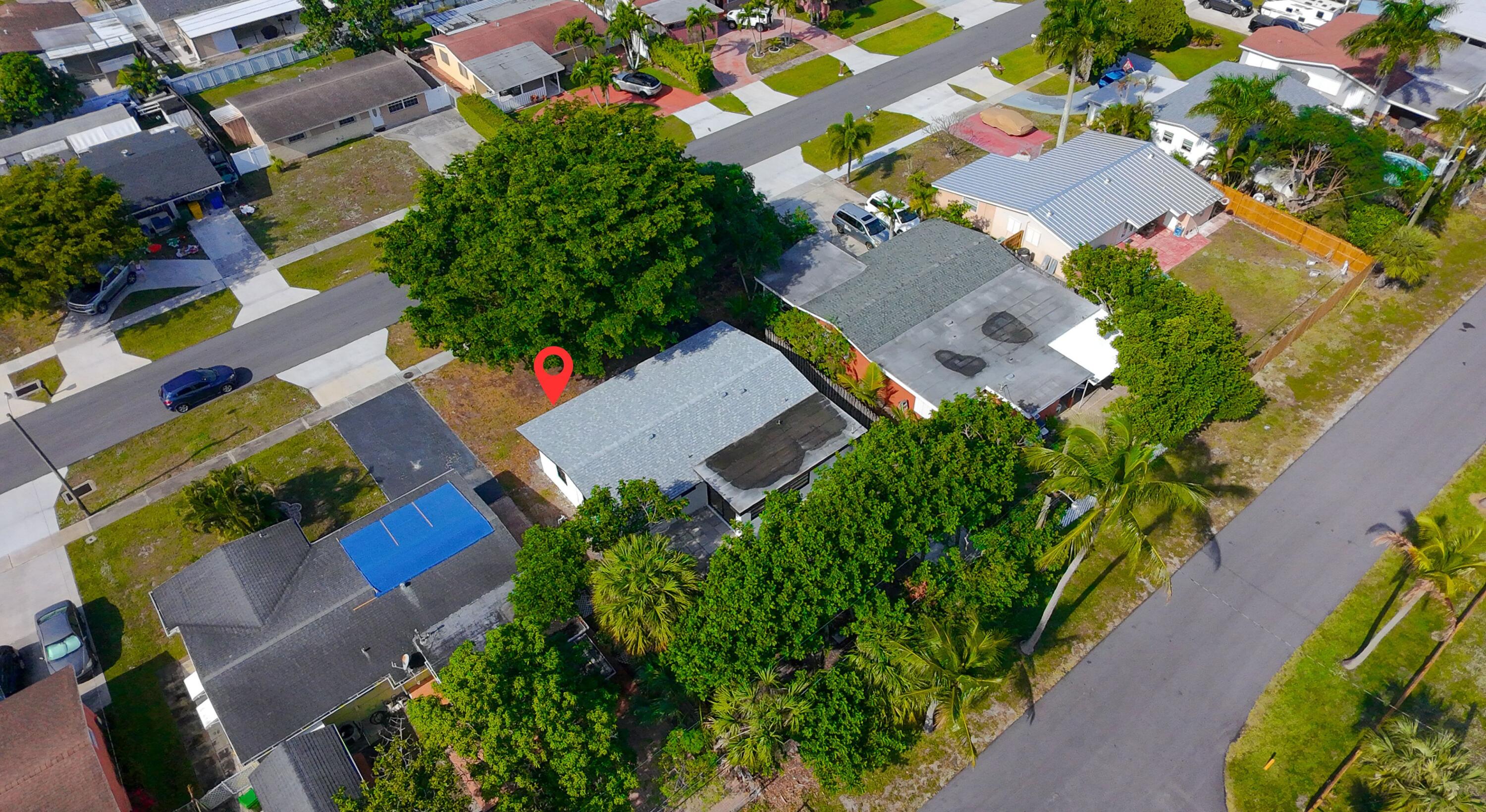 62 Andros Road Palm Springs, FL 33461 - Photo 36 of 41 an aerial view of a house with a yard