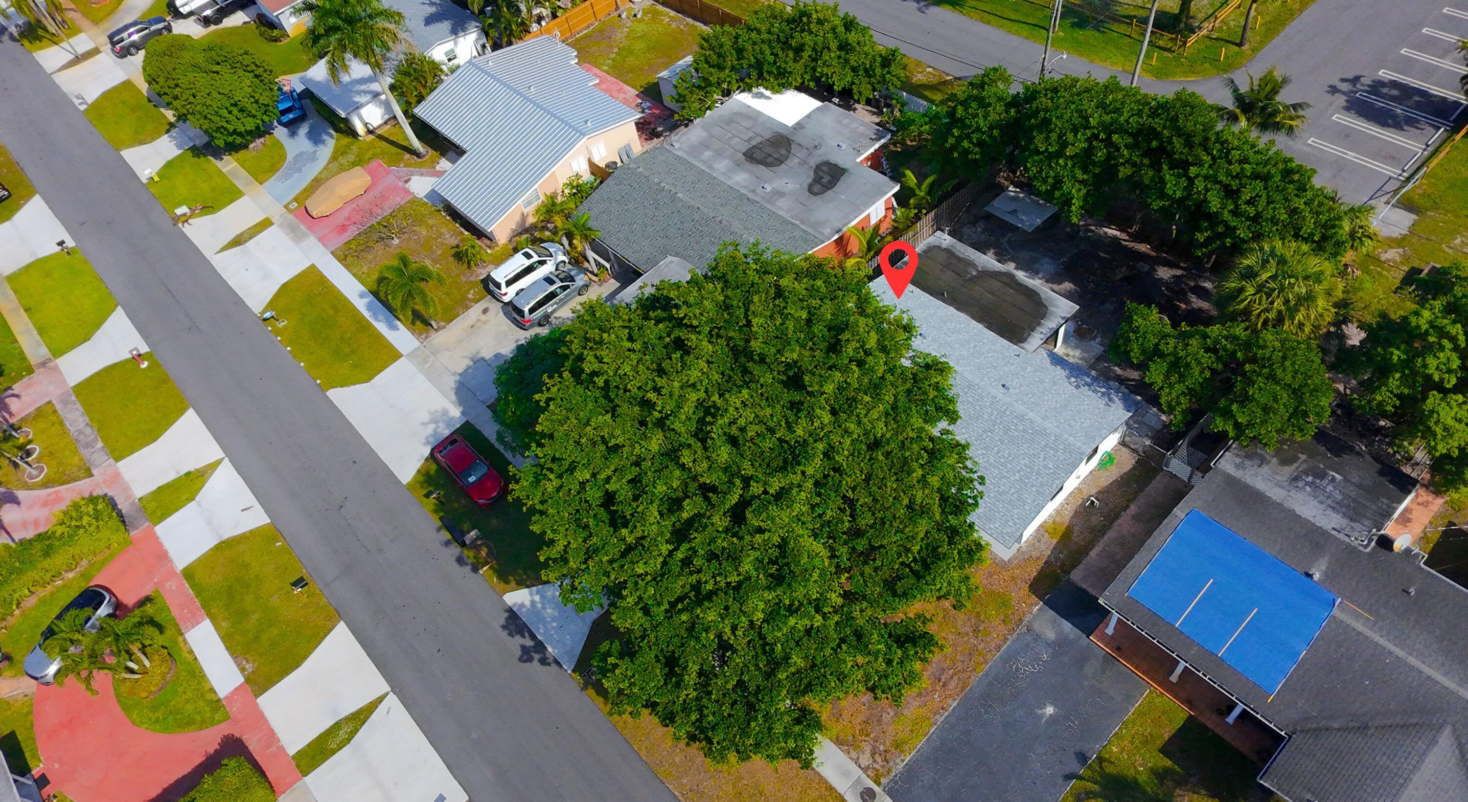 62 Andros Road Palm Springs, FL 33461 - Photo 38 of 41 an aerial view of residential house with outdoor space and swimming pool