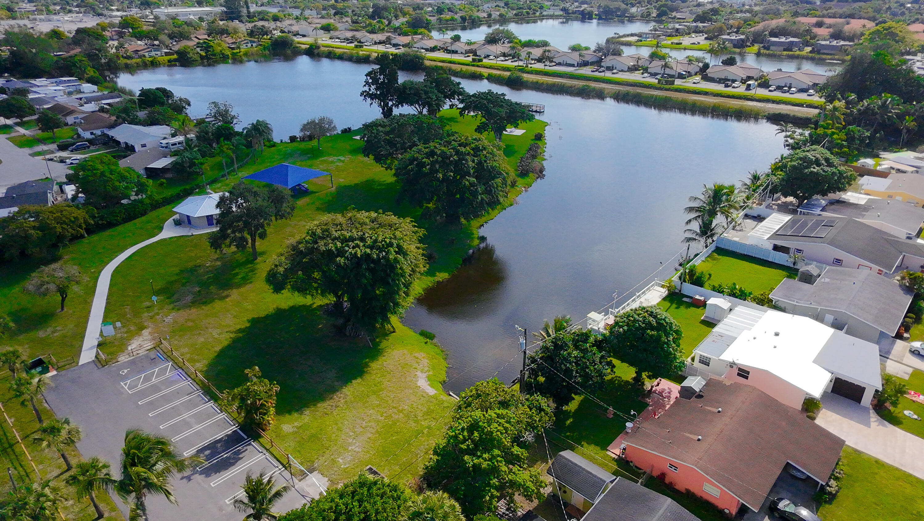 62 Andros Road Palm Springs, FL 33461 - Photo 40 of 41 an aerial view of residential house with outdoor space and lake view