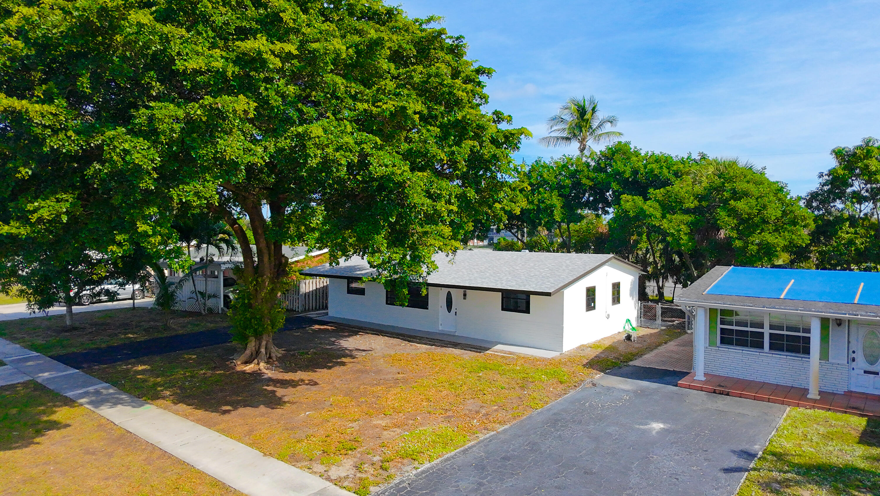 62 Andros Road Palm Springs, FL 33461 - Photo 41 of 41 swimming pool view with a seating space