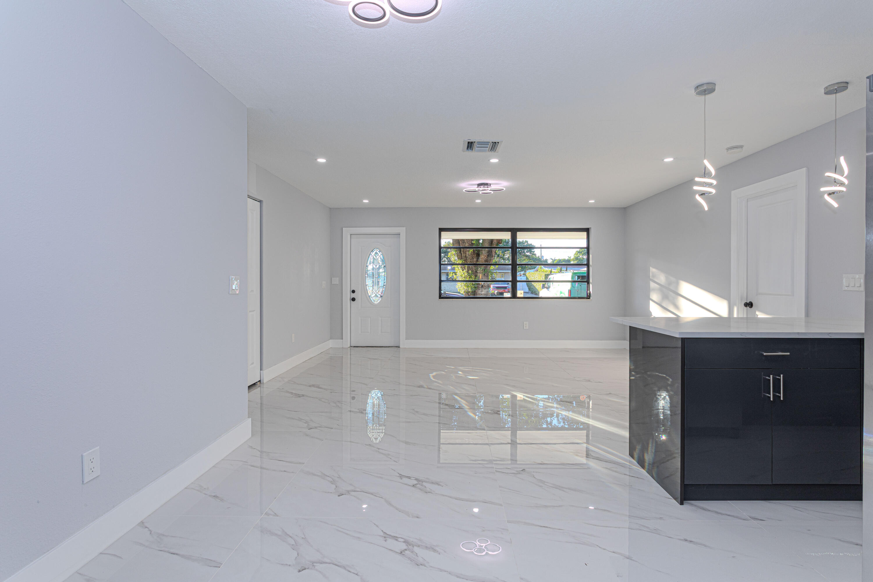 62 Andros Road Palm Springs, FL 33461 - Photo 5 of 41 a view of kitchen with windows