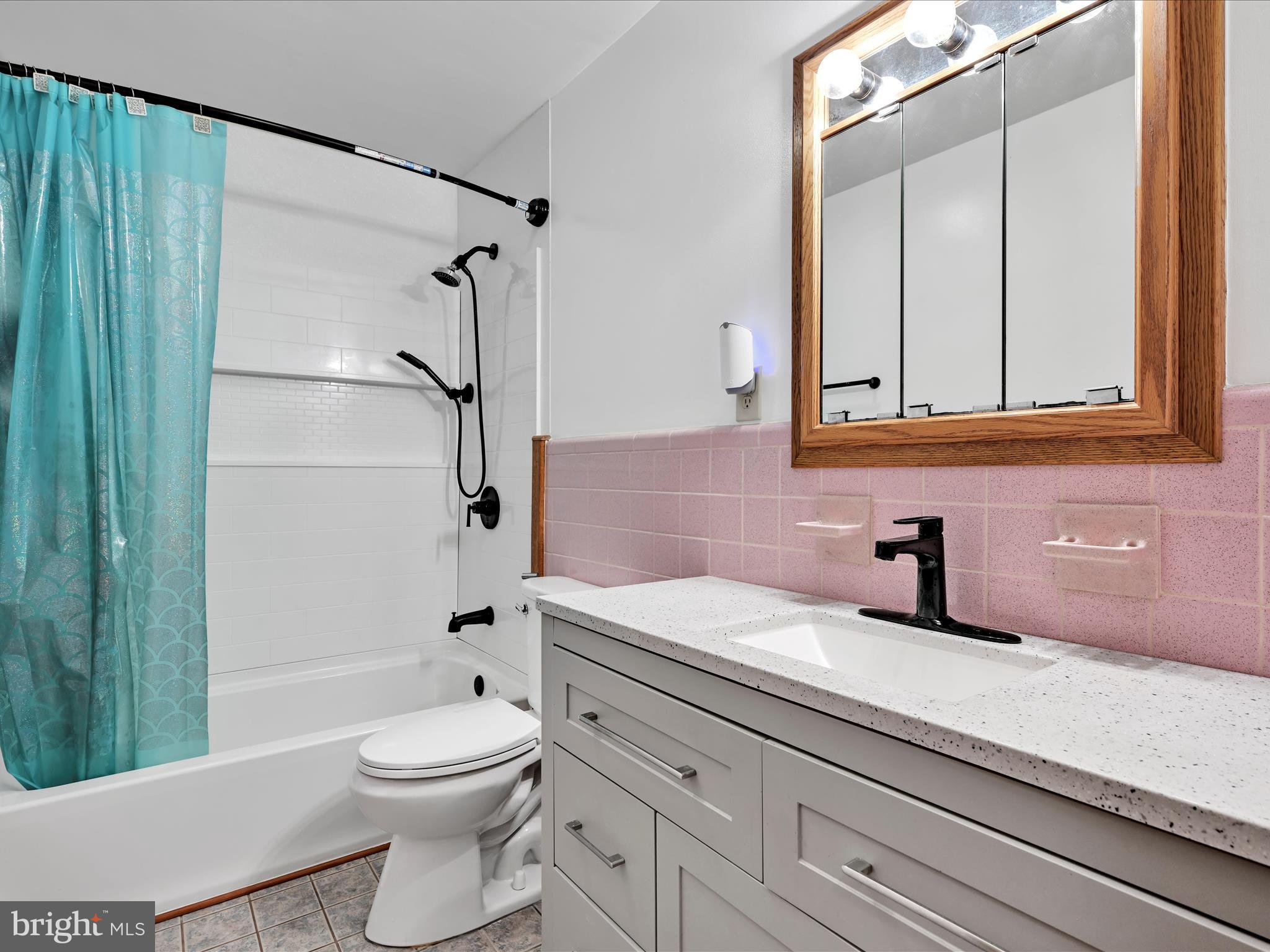 7932 Jonestown Road Harrisburg, PA 17112 - Photo 12 of 79 a bathroom with a sink a toilet and shower