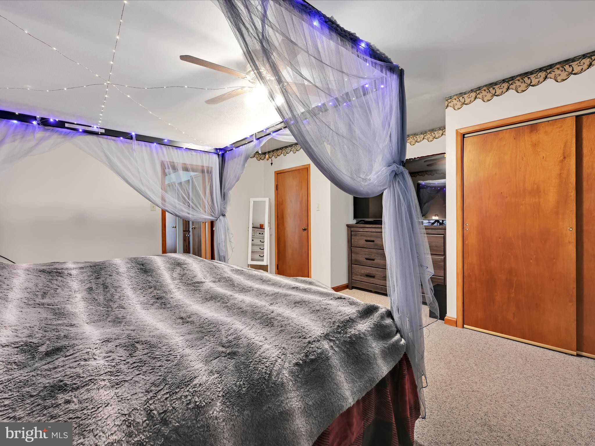 7932 Jonestown Road Harrisburg, PA 17112 - Photo 16 of 79 a bedroom with a bed and a large window