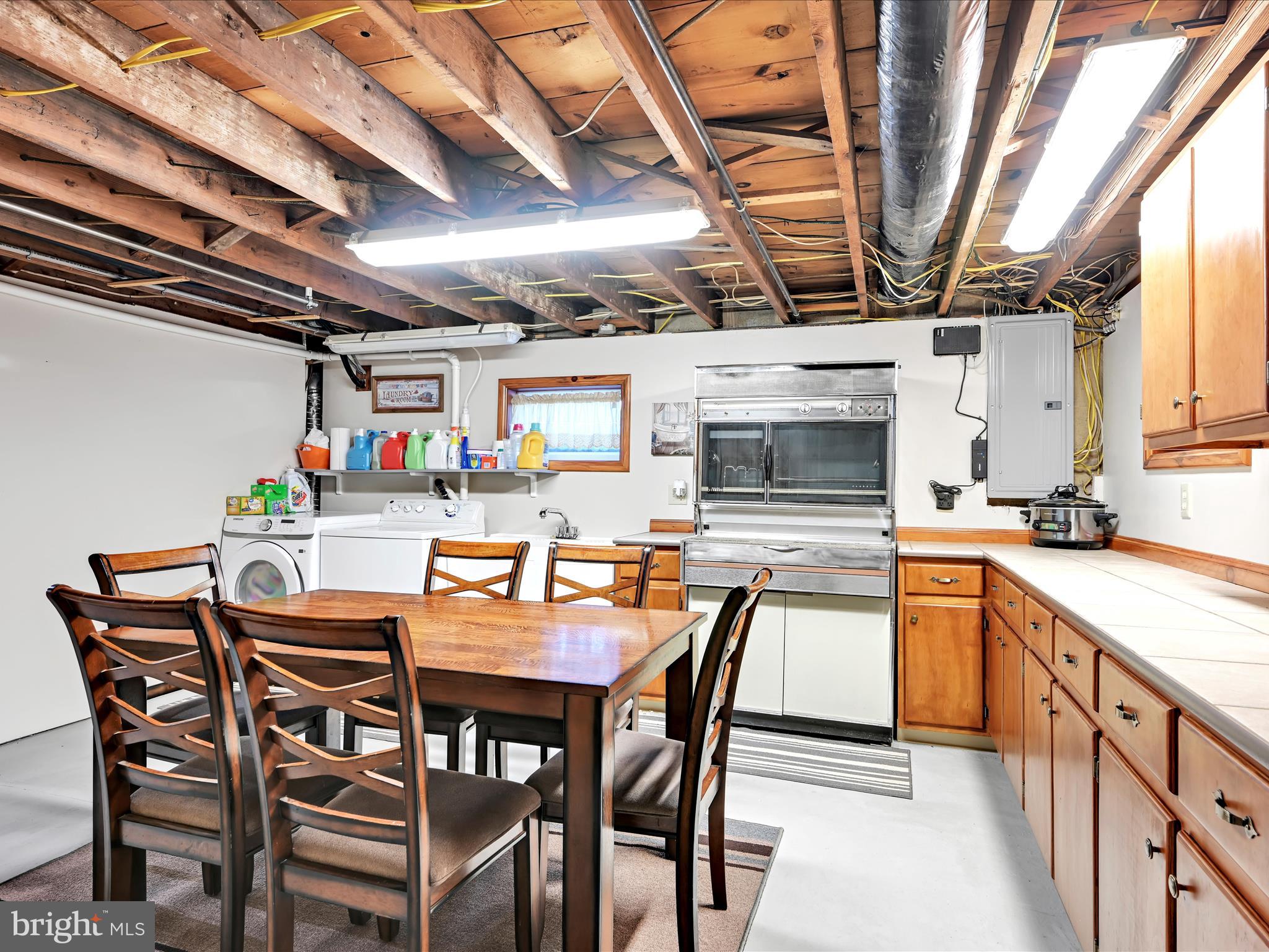 7932 Jonestown Road Harrisburg, PA 17112 - Photo 20 of 79 a dining table with chairs and kitchen view