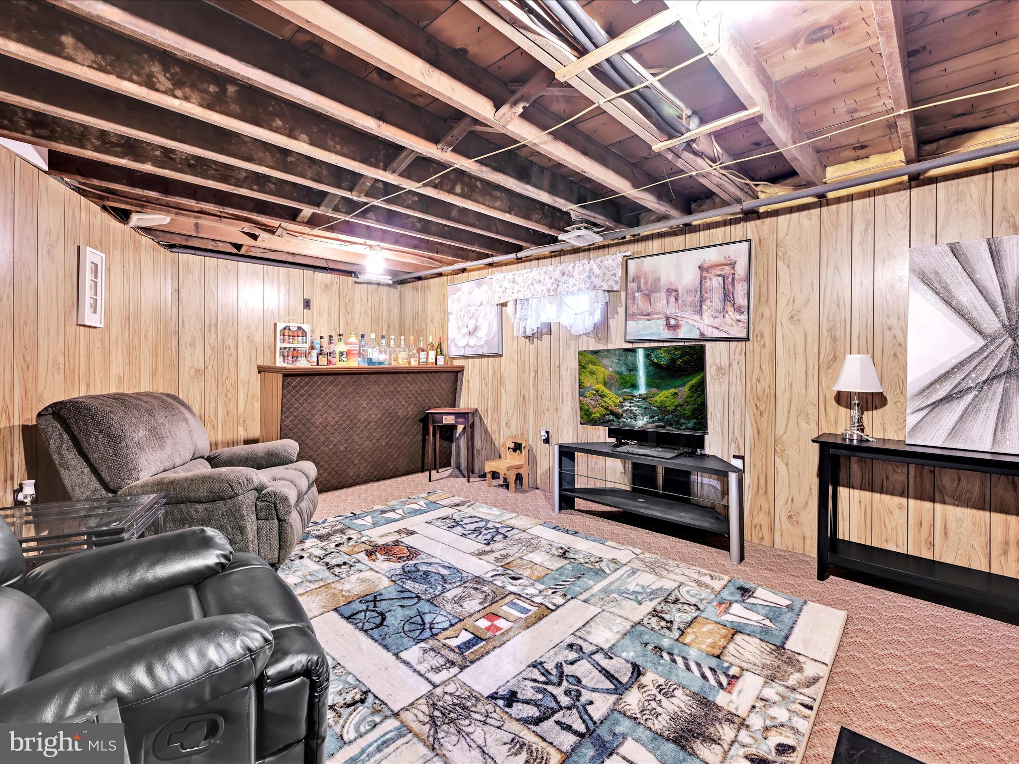 7932 Jonestown Road Harrisburg, PA 17112 - Photo 23 of 79 a living room with furniture and a flat screen tv