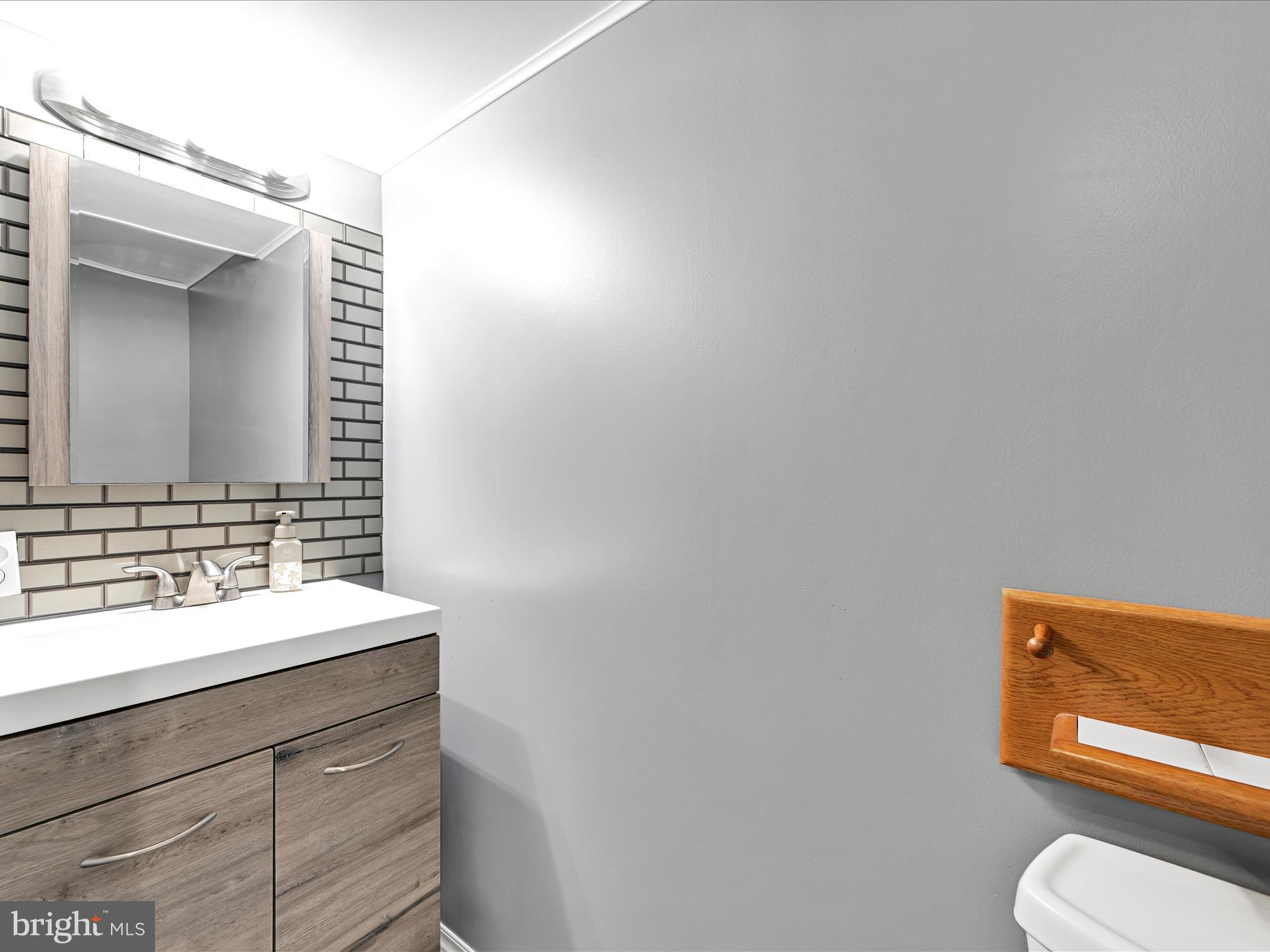 7932 Jonestown Road Harrisburg, PA 17112 - Photo 25 of 79 a bathroom with a toilet a sink and mirror