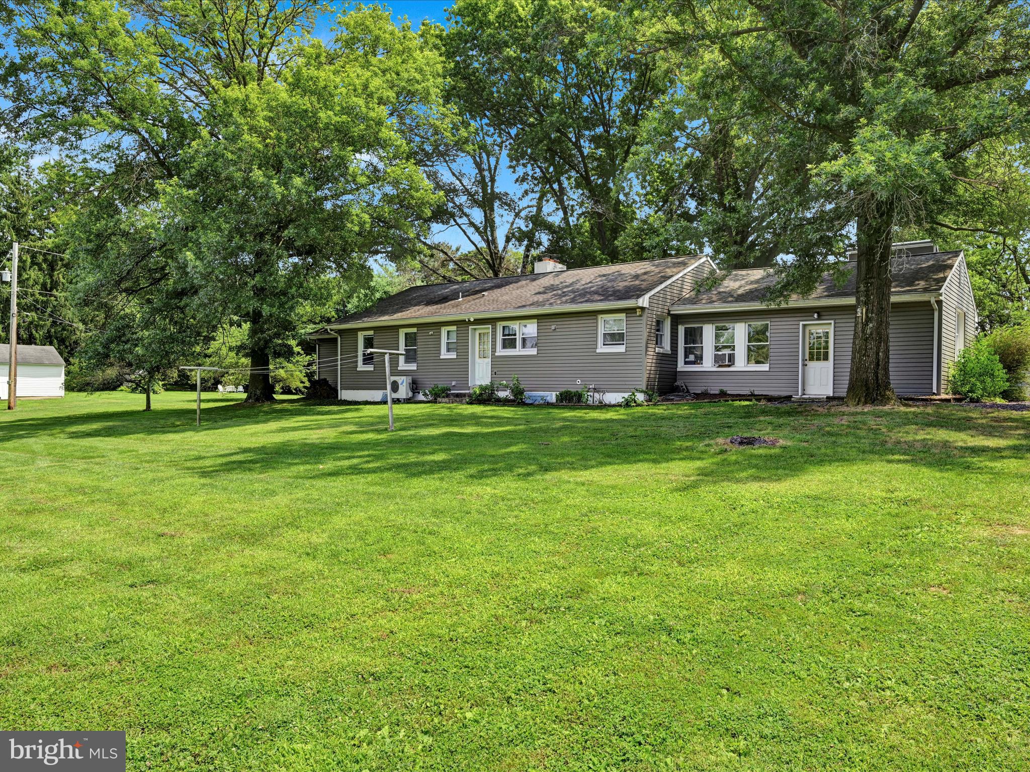 7932 Jonestown Road Harrisburg, PA 17112 - Photo 33 of 79 a view of a house with a big yard and large trees