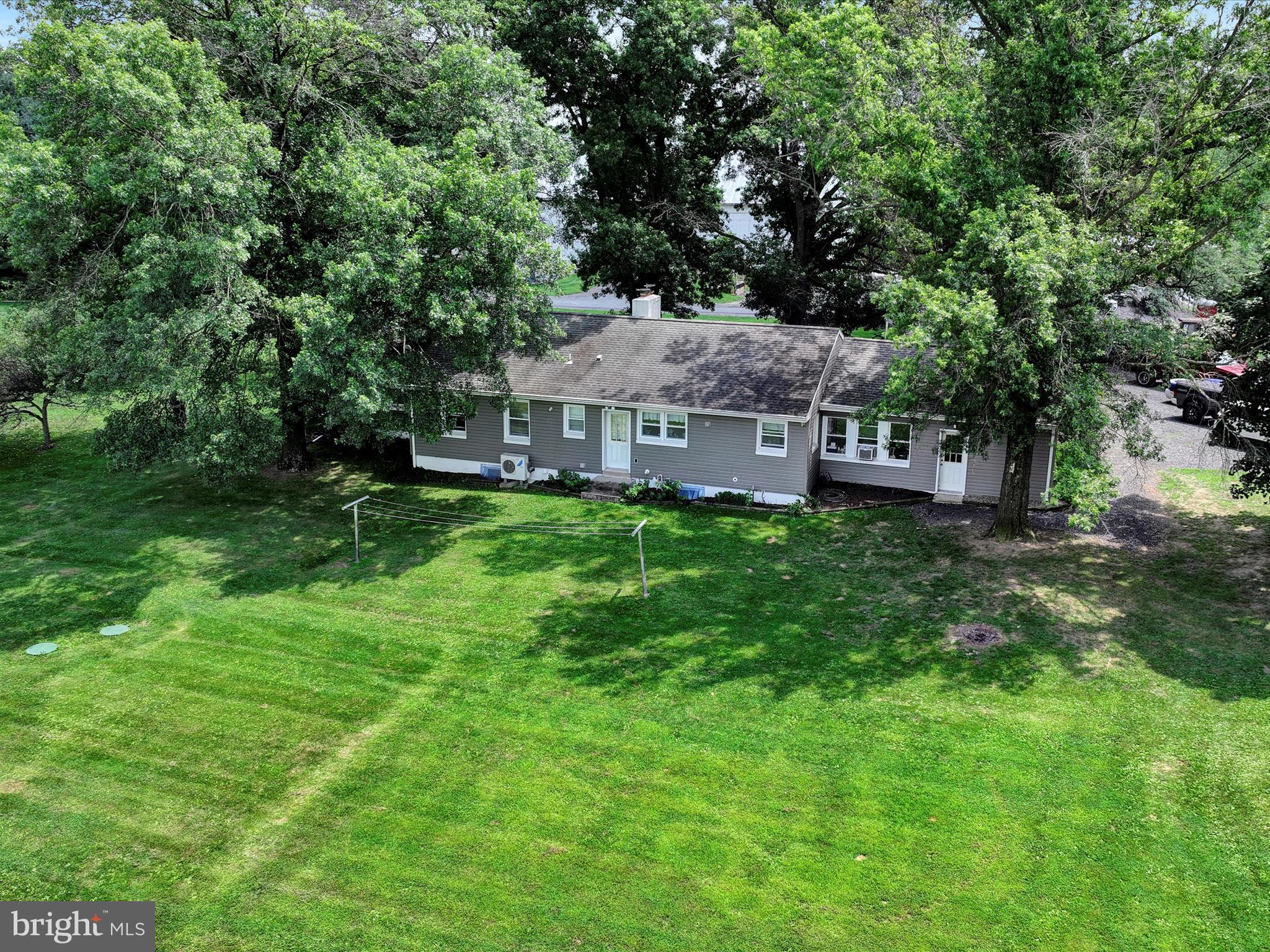 7932 Jonestown Road Harrisburg, PA 17112 - Photo 75 of 79 a aerial view of a house with a big yard and large trees