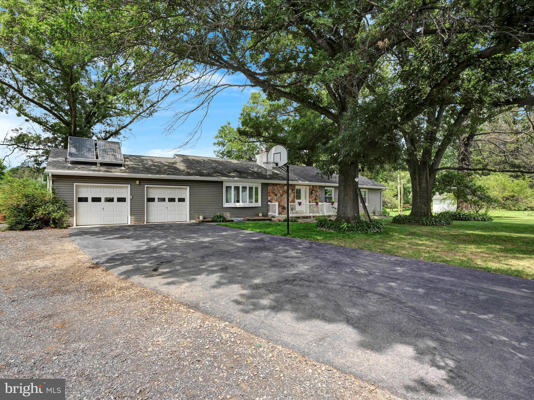 7932 Jonestown Road Harrisburg, PA 17112 - Photo 76 of 79 a front view of a house with a garden and trees