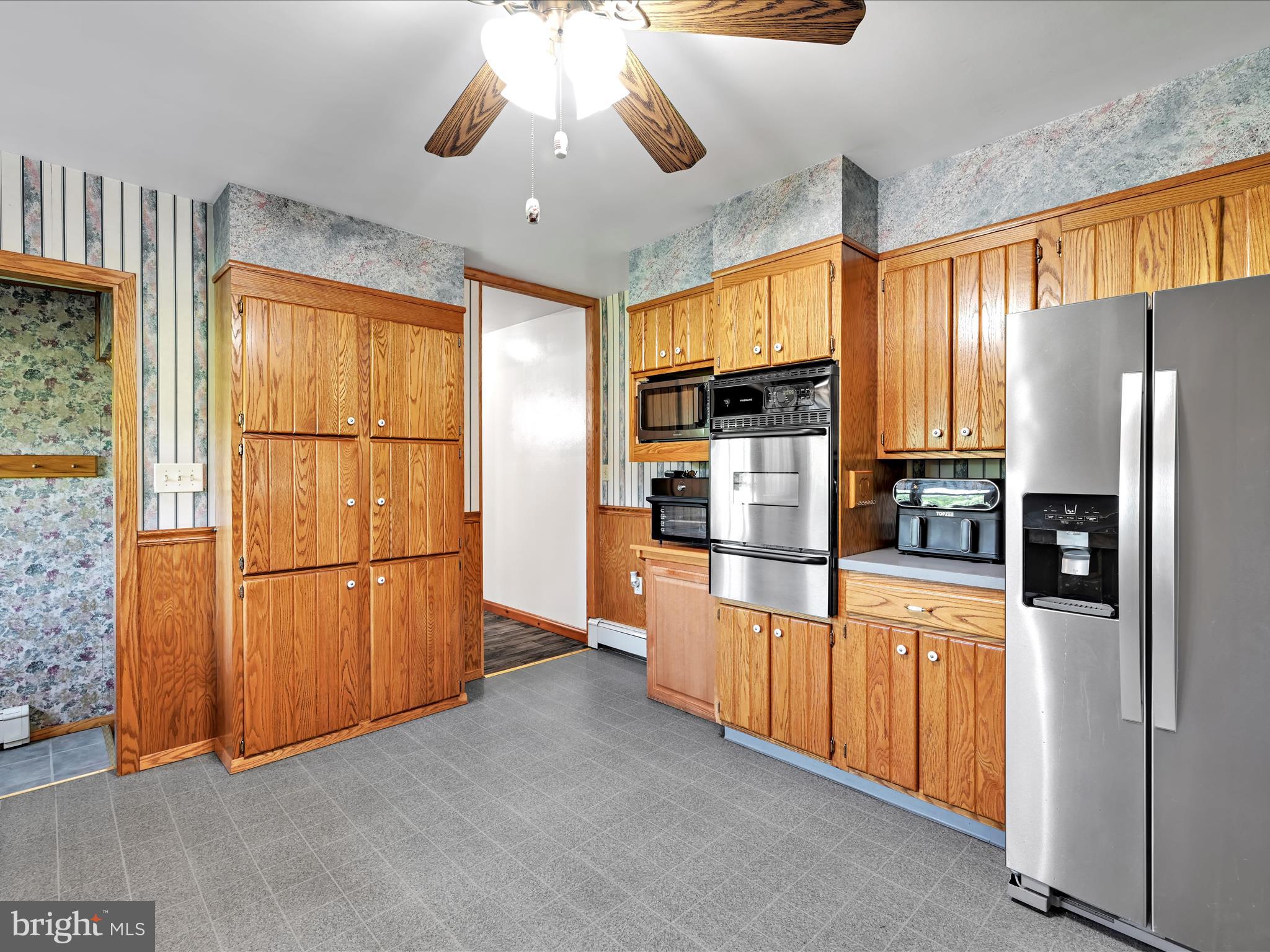 7932 Jonestown Road Harrisburg, PA 17112 - Photo 10 of 79 a kitchen with stainless steel appliances granite countertop a refrigerator a oven a sink and a refrigerator