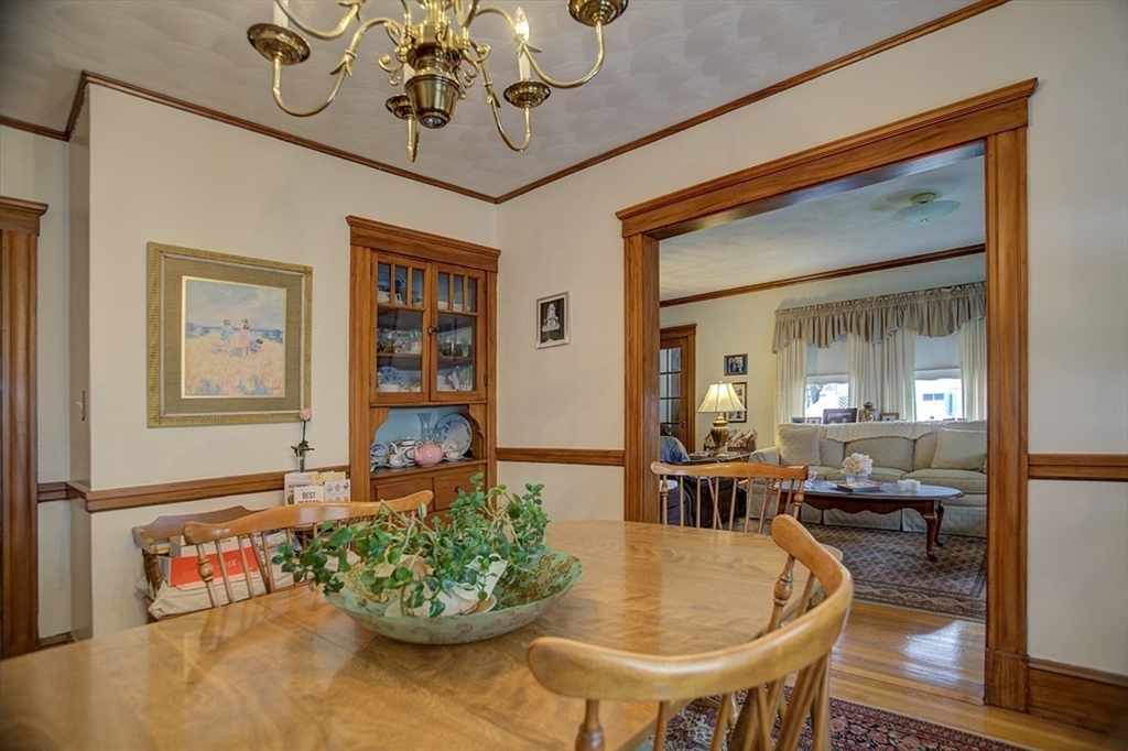 44 Cottage Park Road Winthrop, MA 02152 - Photo 29 of 39 a living room with furniture and a chandelier