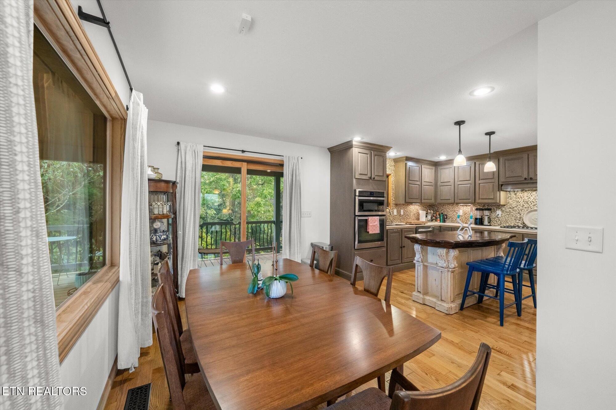720 East Roddy Road Spring City, TN 37381 - Photo 11 of 58 a view of a dining room with furniture window and outside view
