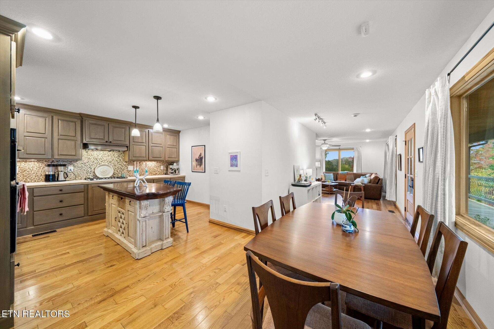 720 East Roddy Road Spring City, TN 37381 - Photo 12 of 58 a view of a dining room with furniture and wooden floor