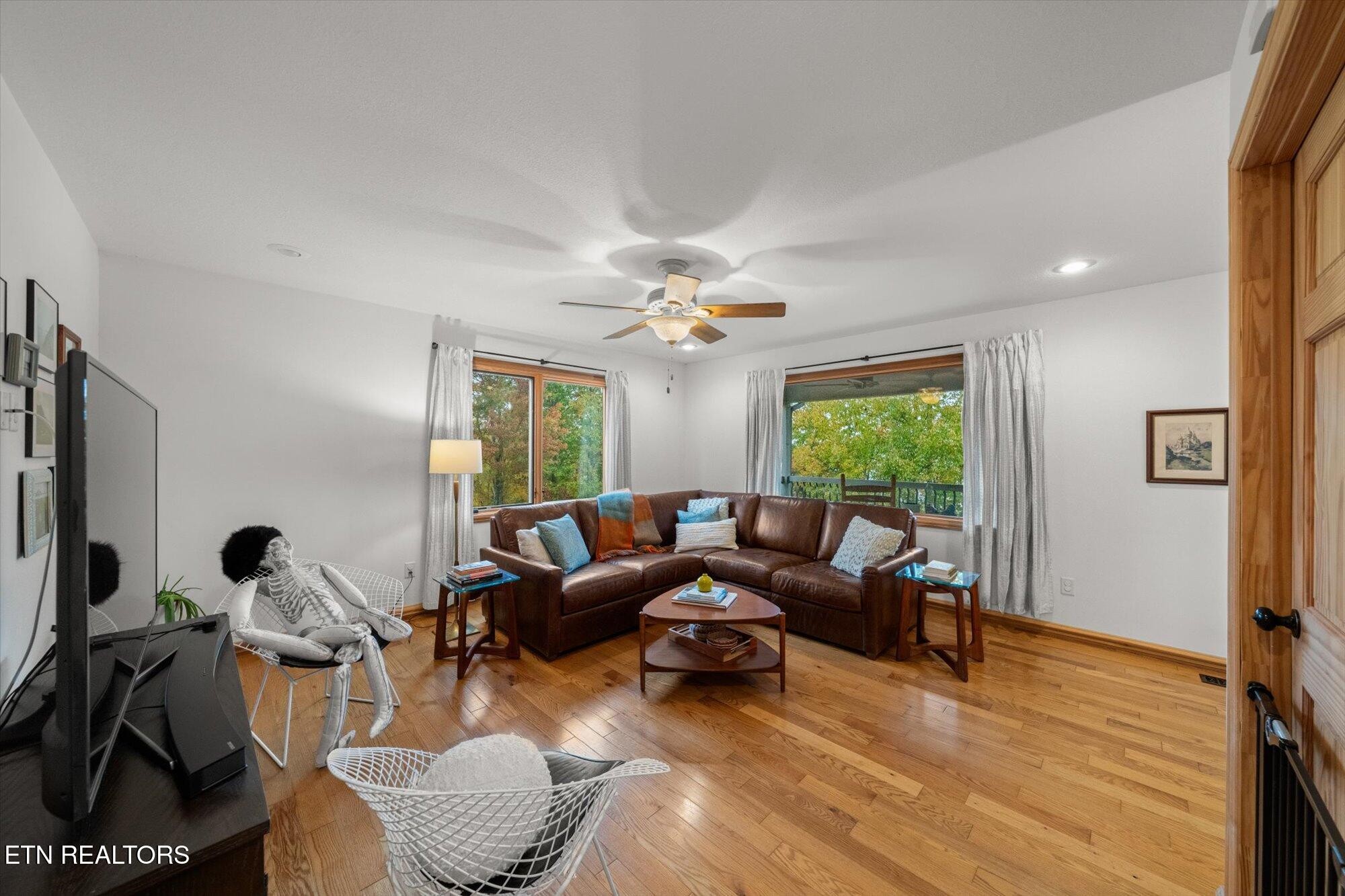 720 East Roddy Road Spring City, TN 37381 - Photo 22 of 58 a living room with furniture and a large window