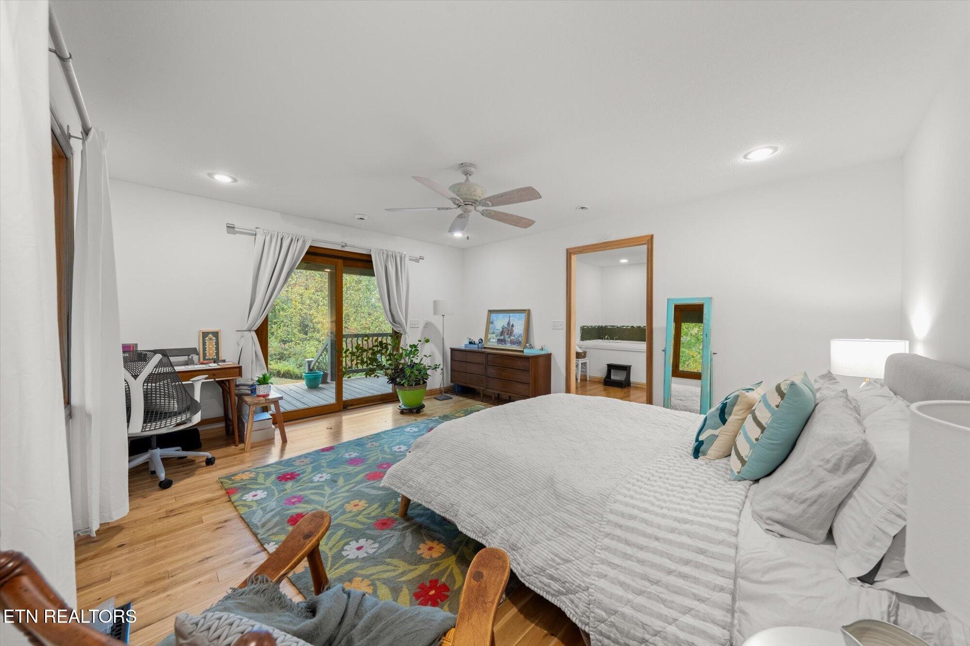 720 East Roddy Road Spring City, TN 37381 - Photo 25 of 58 a large bedroom with a bed and a large window