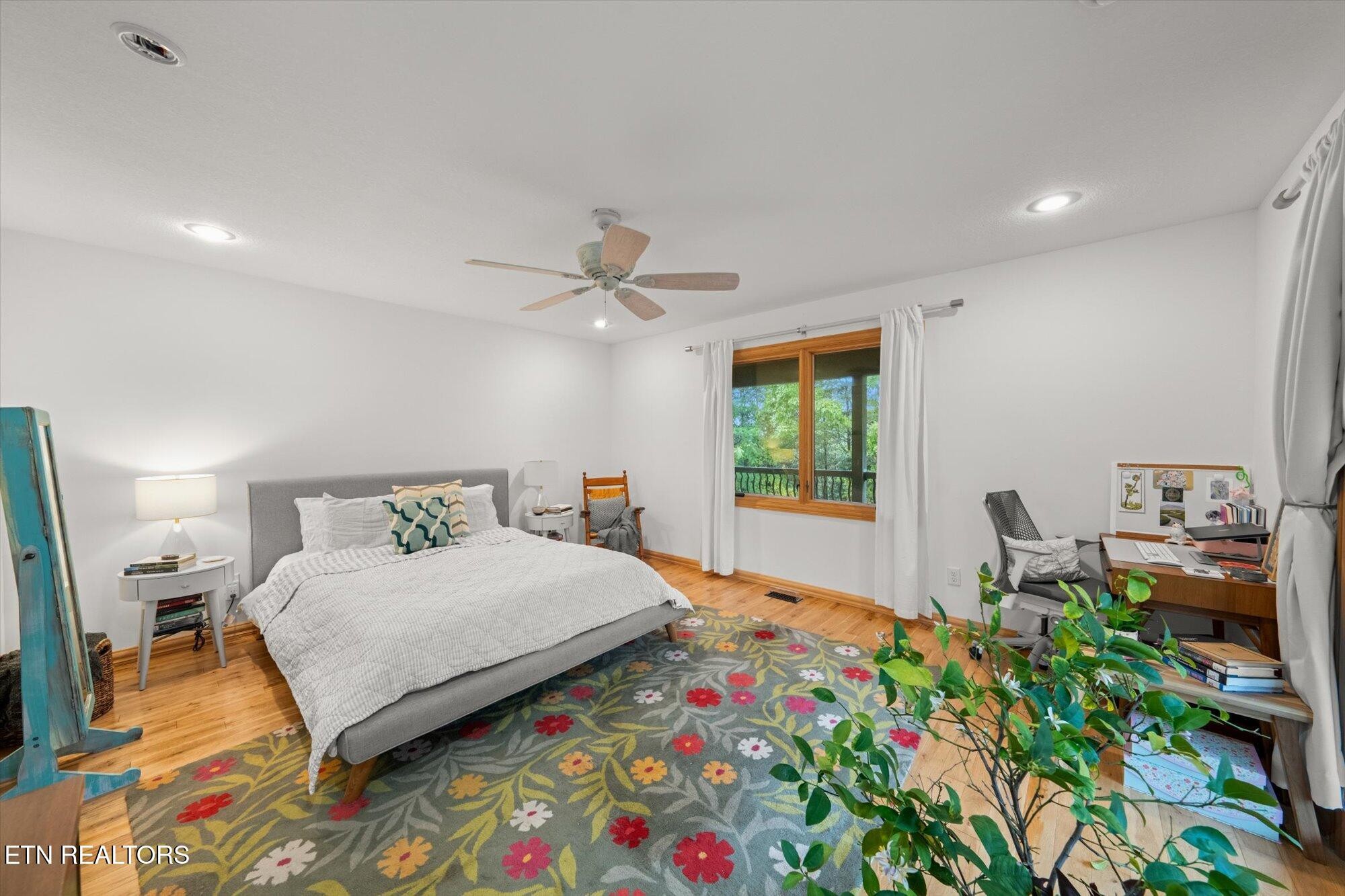 720 East Roddy Road Spring City, TN 37381 - Photo 26 of 58 a bedroom with a bed and a chandelier