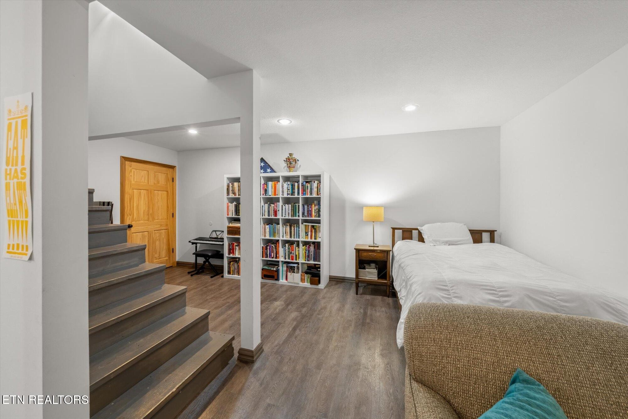 720 East Roddy Road Spring City, TN 37381 - Photo 31 of 58 a bedroom with furniture and a book shelf