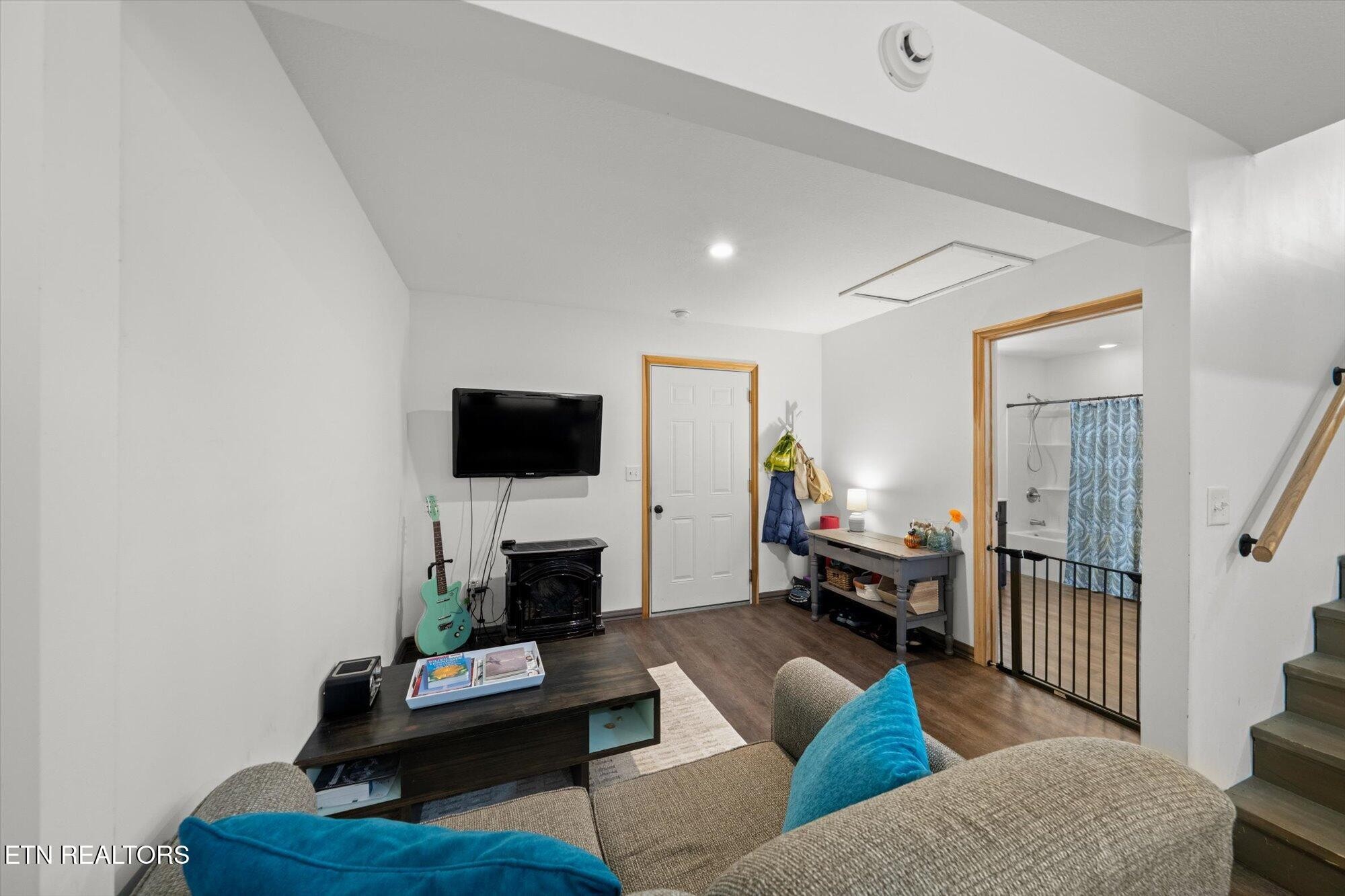 720 East Roddy Road Spring City, TN 37381 - Photo 33 of 58 a living room with furniture and a flat screen tv