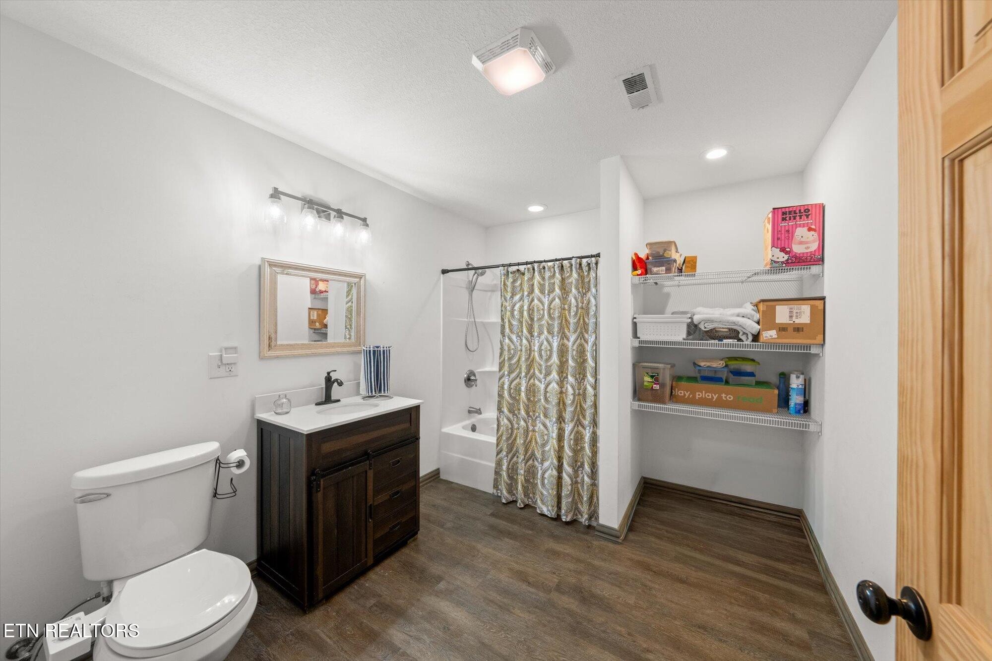 720 East Roddy Road Spring City, TN 37381 - Photo 34 of 58 a bathroom with a toilet a sink and a mirror