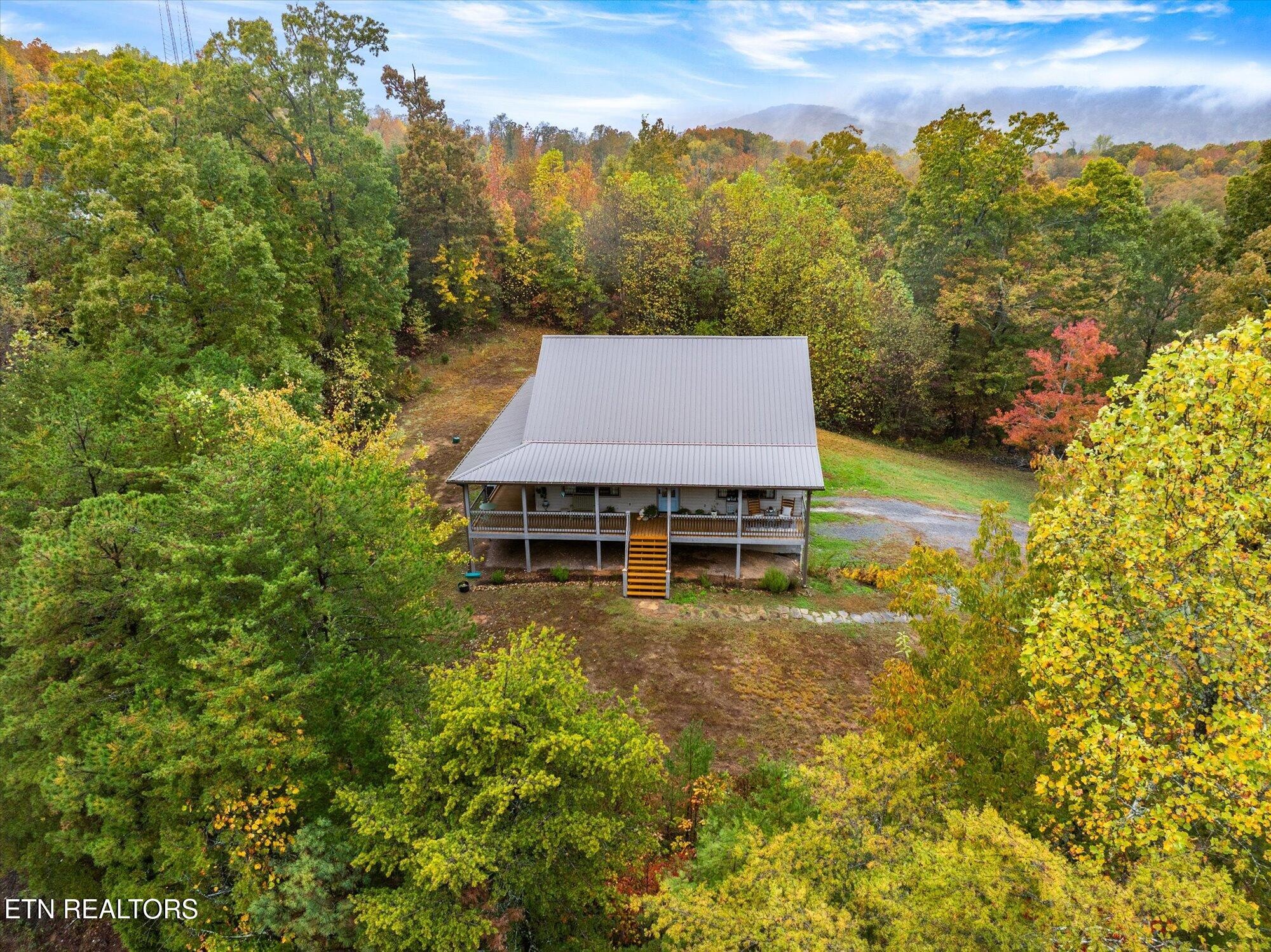 720 East Roddy Road Spring City, TN 37381 - Photo 37 of 58 a view of a house with a yard