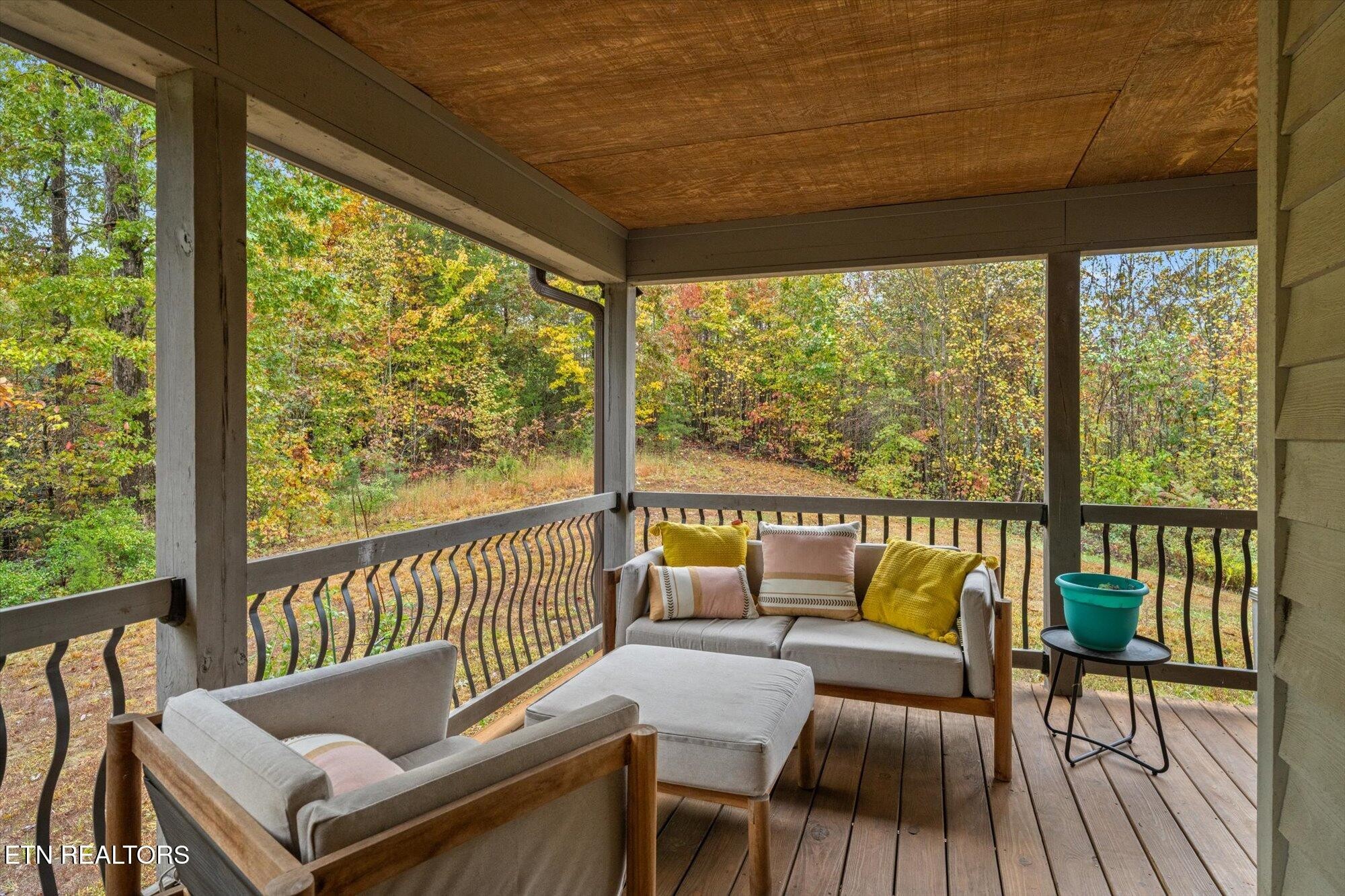 720 East Roddy Road Spring City, TN 37381 - Photo 39 of 58 a view of a chairs and table in patio with wooden floor