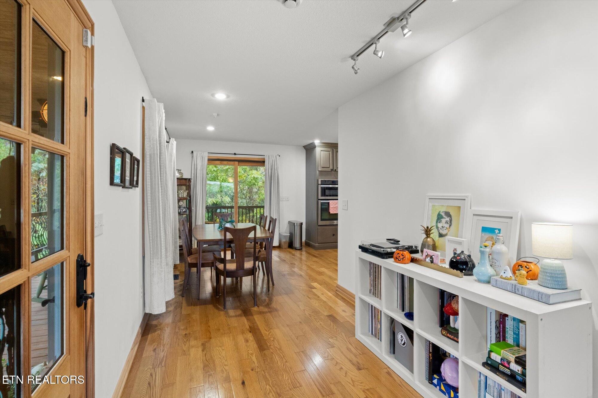 720 East Roddy Road Spring City, TN 37381 - Photo 10 of 58 a dining room with lots of furniture and wooden floor