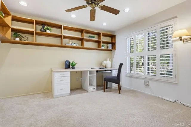a view of a chairs and table in a room