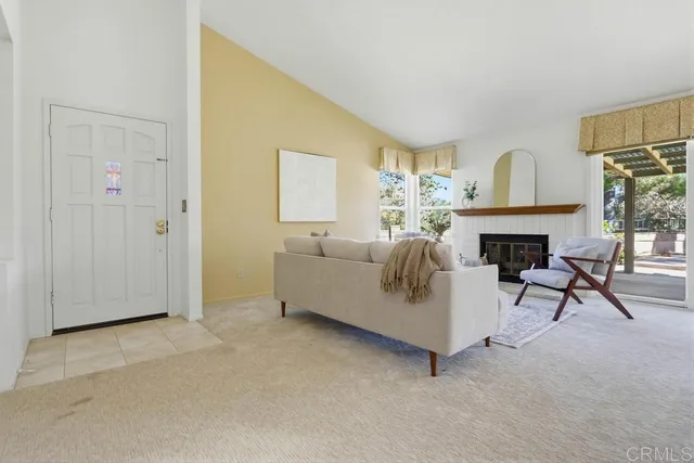 a view of a dining room with furniture and a window