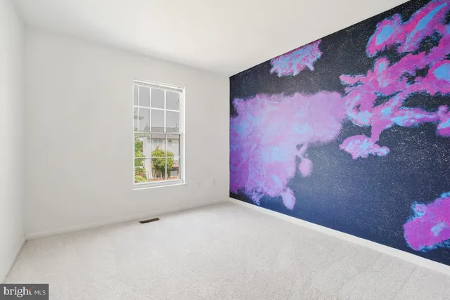 a view of empty room with windows