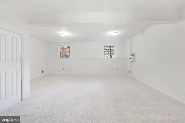 an empty room with white walls and white walls