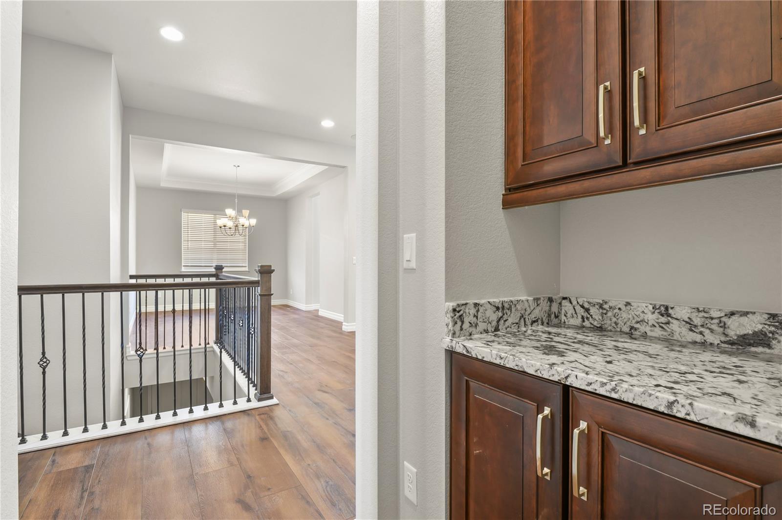 12938 Bridge View Lane Parker, CO 80134 - Photo 27 of 47 a view of a kitchen from the hallway