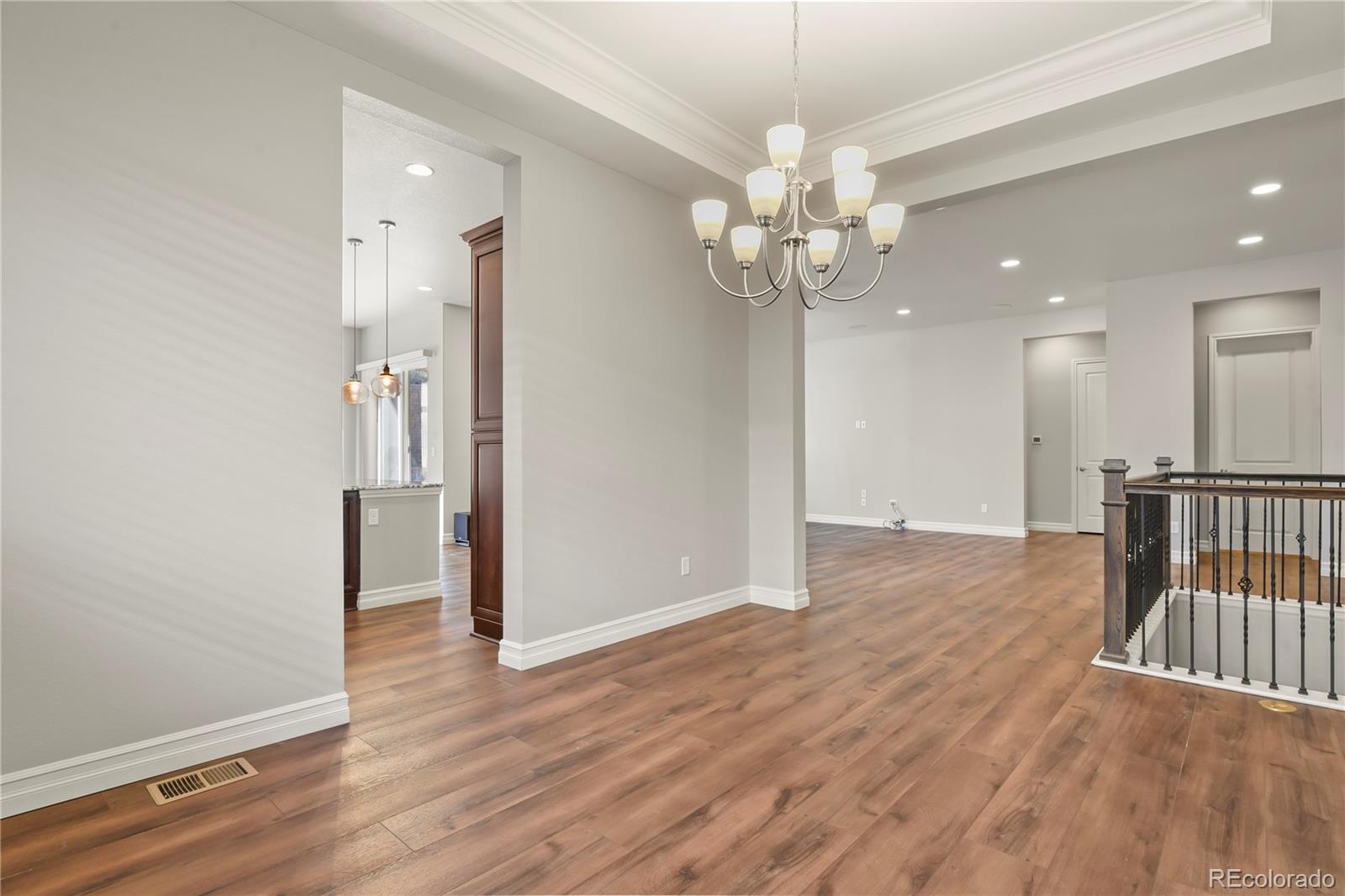 12938 Bridge View Lane Parker, CO 80134 - Photo 10 of 47 an empty room with wooden floor and a ceiling fan