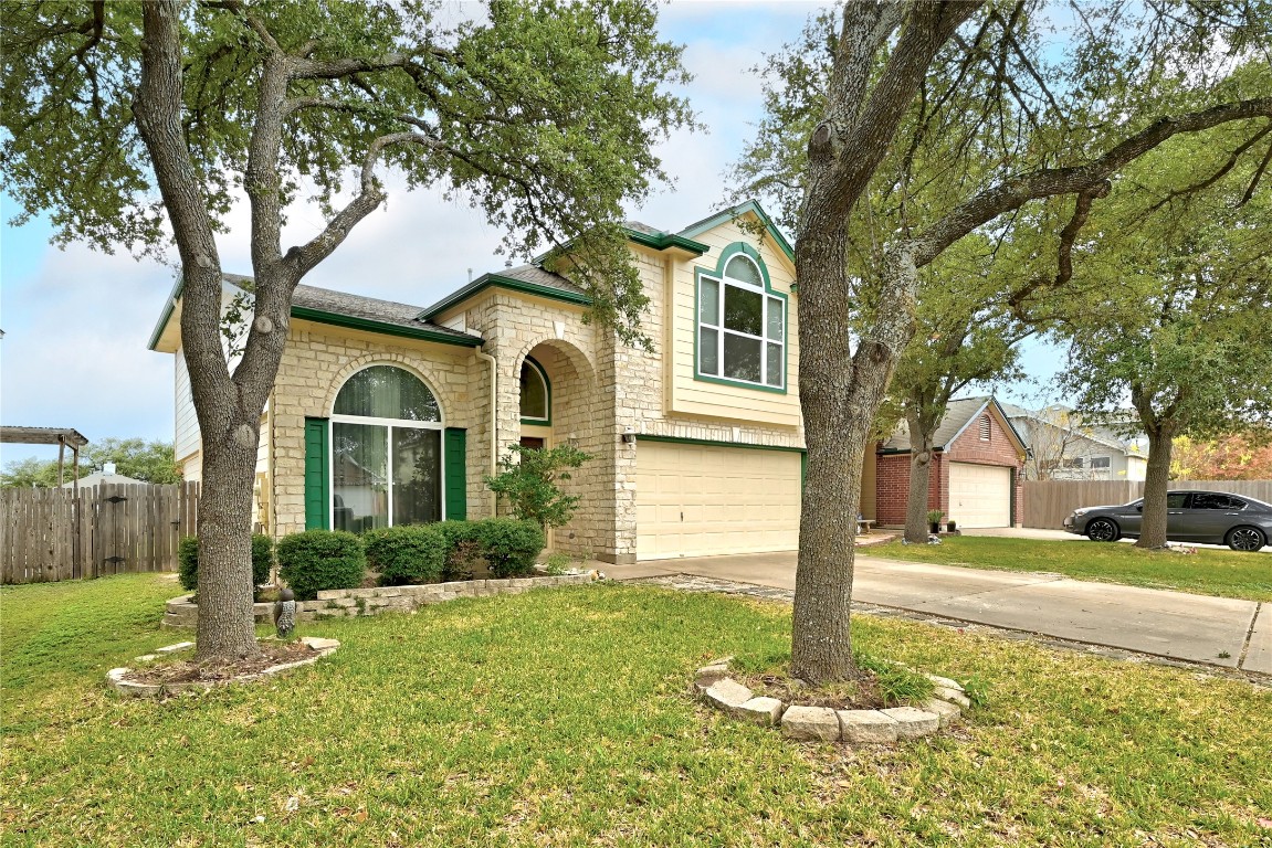 910 Kirtomy Loop Pflugerville, TX 78660 - Photo 22 of 37 a front view of a house with a yard and trees