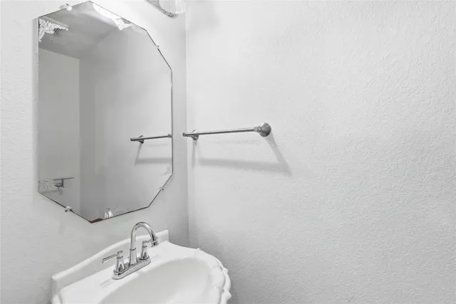 a kitchen with stainless steel appliances granite countertop a stove top oven a sink a counter space and cabinets