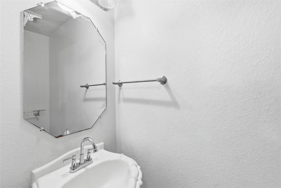 910 Kirtomy Loop Pflugerville, TX 78660 - Photo 24 of 37 a bathroom with a sink and mirror