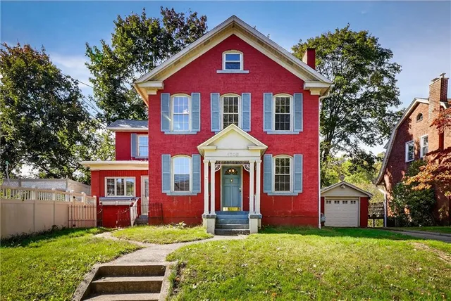 a front view of a house with yard