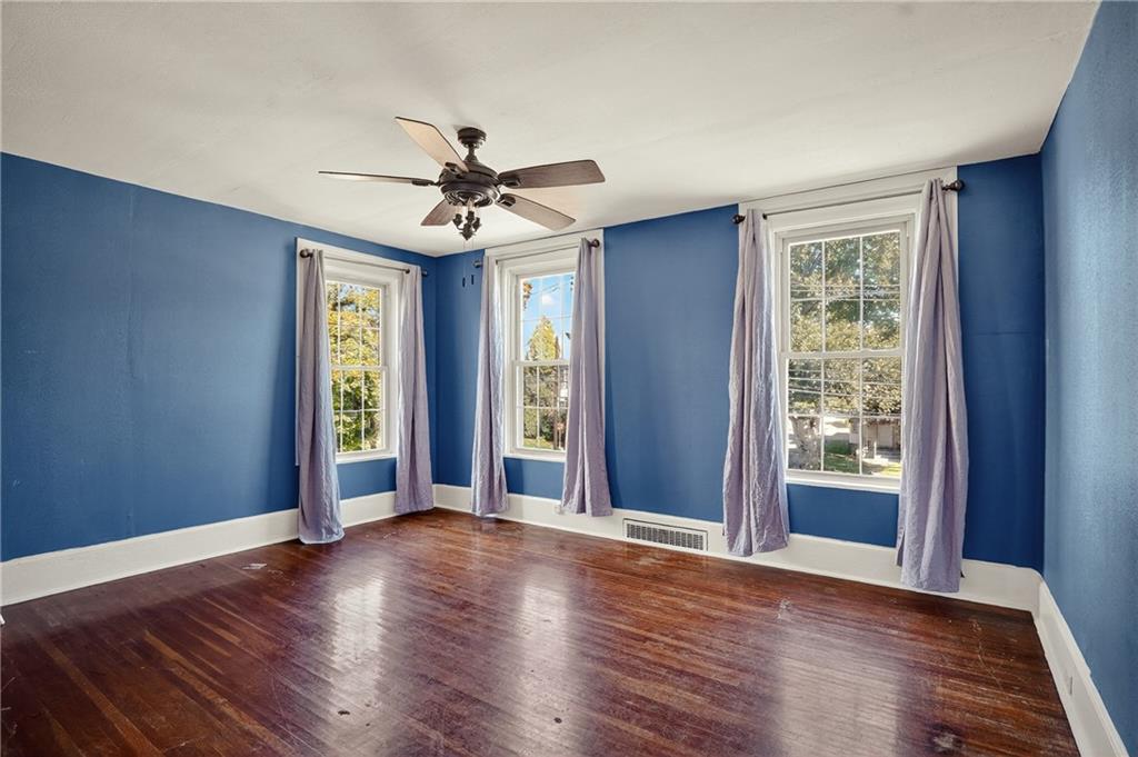 1702 3rd Avenue New Brighton, PA 15066 - Photo 12 of 40 a view of an empty room with window and wooden floor