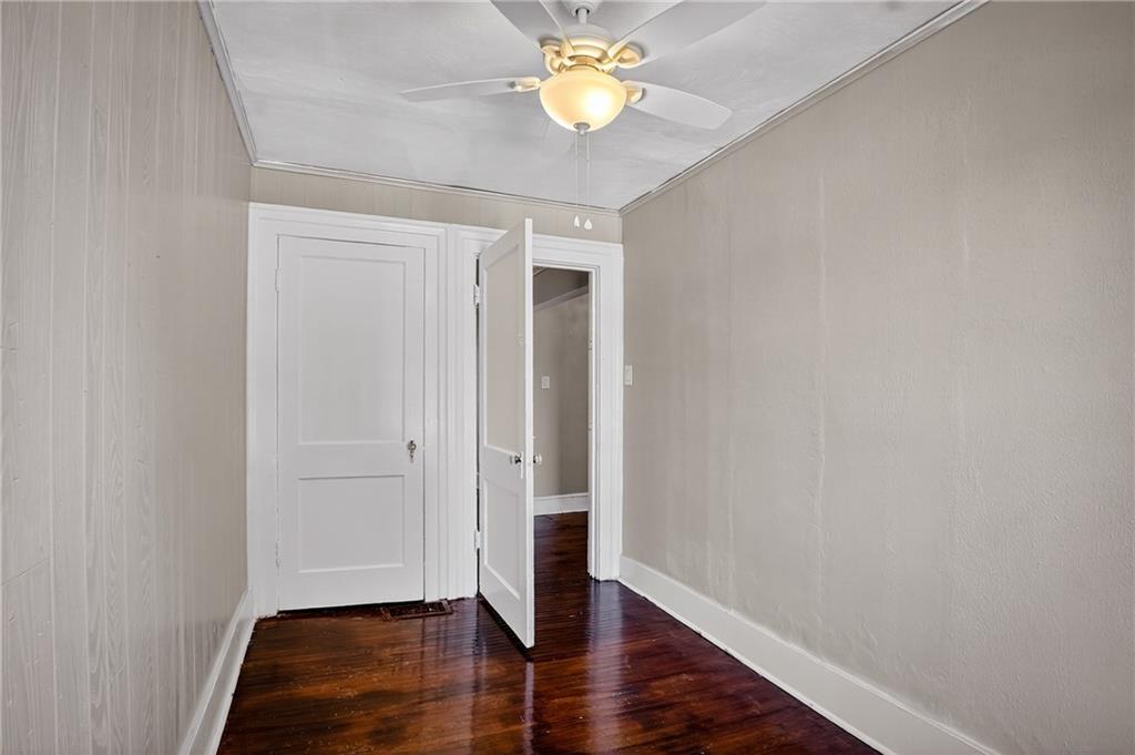 1702 3rd Avenue New Brighton, PA 15066 - Photo 15 of 40 an empty room with wooden floor and a ceiling fan