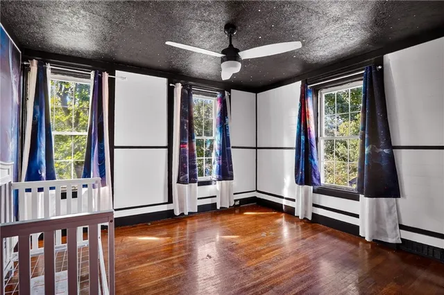 a view of an entryway with wooden floor