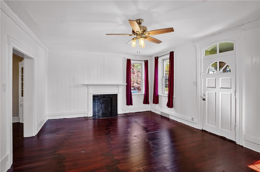 1702 3rd Avenue New Brighton, PA 15066 - Photo 3 of 40 a view of an empty room with window and wooden floor