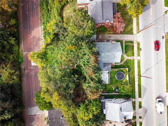 an aerial view of a house with a garden