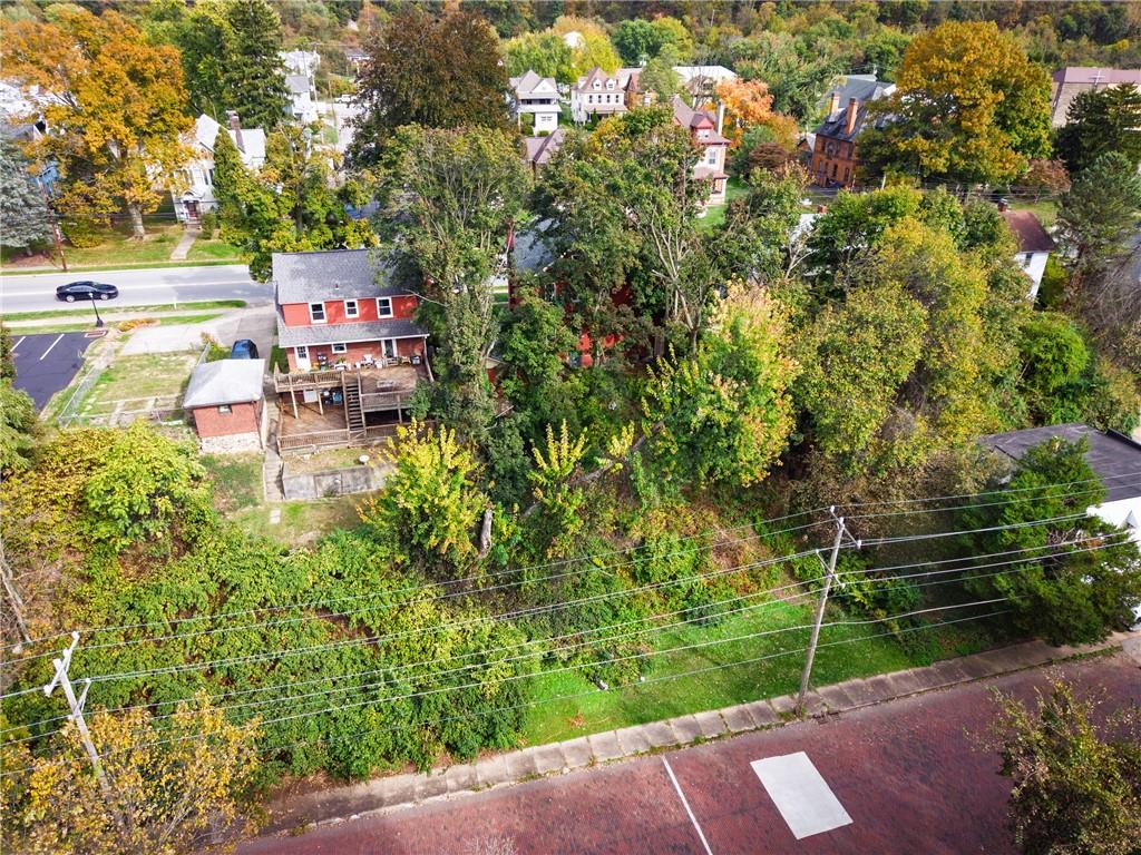 1702 3rd Avenue New Brighton, PA 15066 - Photo 32 of 40 a backyard of a house with lots of green space and fountain