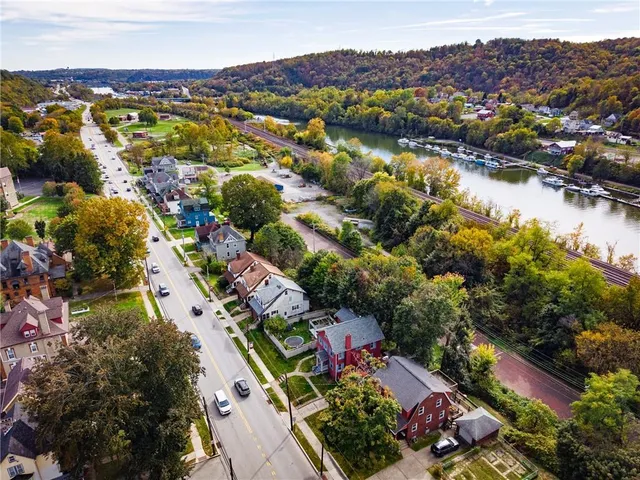 an aerial view of residential houses with outdoor space