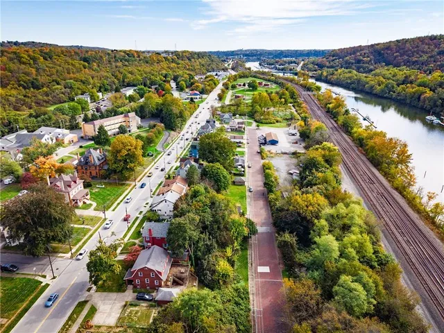 an aerial view of residential houses and city street