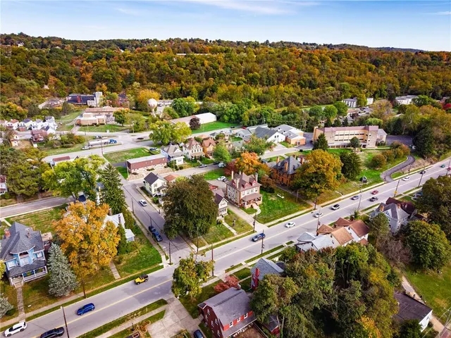 an aerial view of residential houses with outdoor space