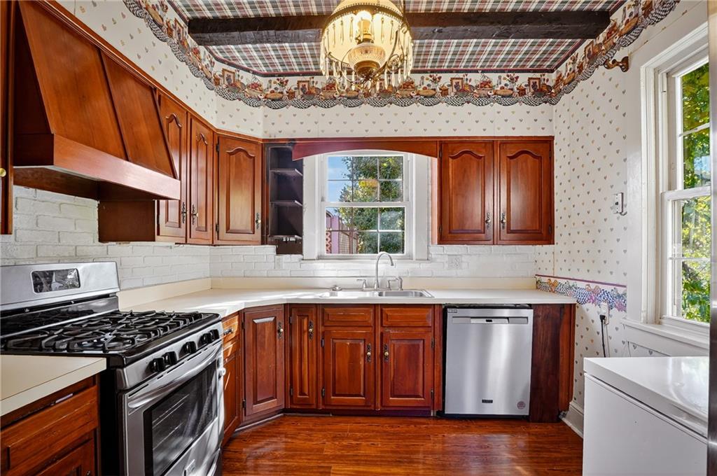 1702 3rd Avenue New Brighton, PA 15066 - Photo 10 of 40 a kitchen with stainless steel appliances granite countertop a stove and a sink