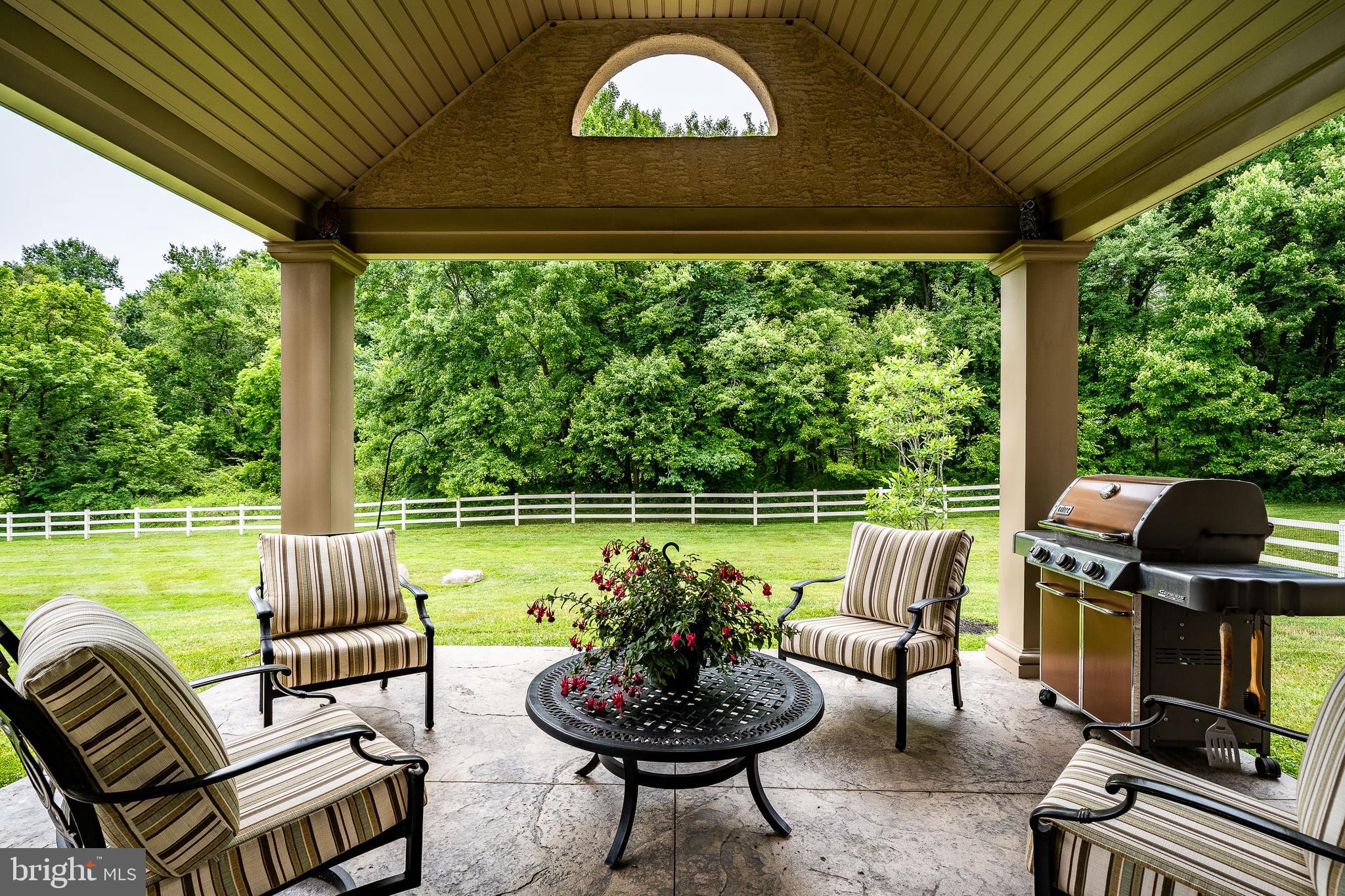 841 Oak Tree Road Kennett Square, PA 19348 - Photo 29 of 99 a view of a chairs and table in patio next to a yard