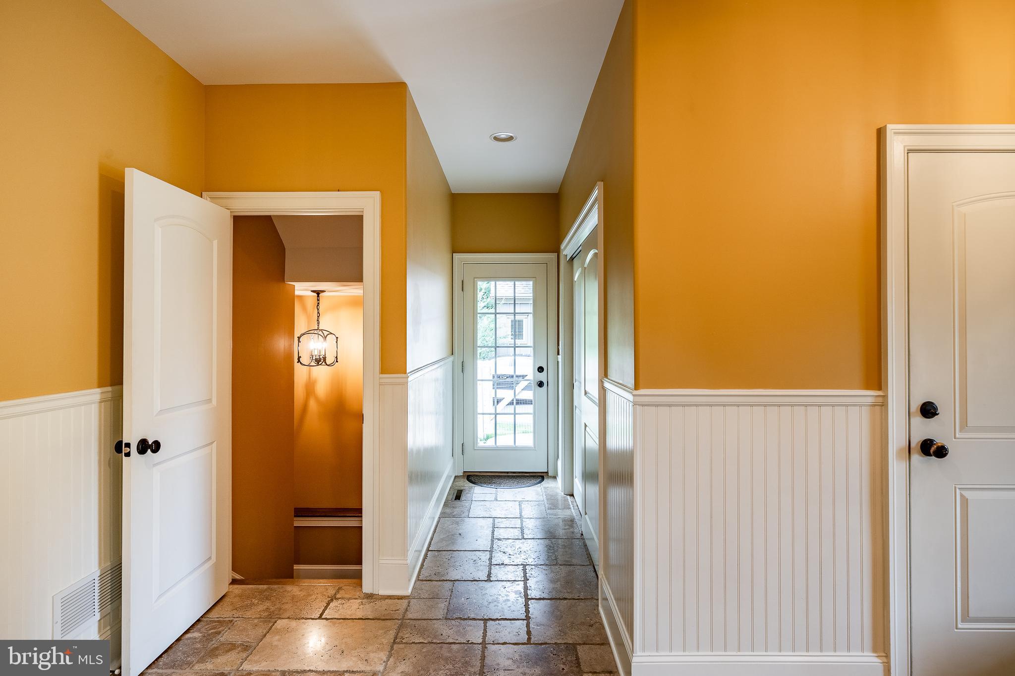 841 Oak Tree Road Kennett Square, PA 19348 - Photo 36 of 99 a view of a hallway with wooden floor and a livingroom